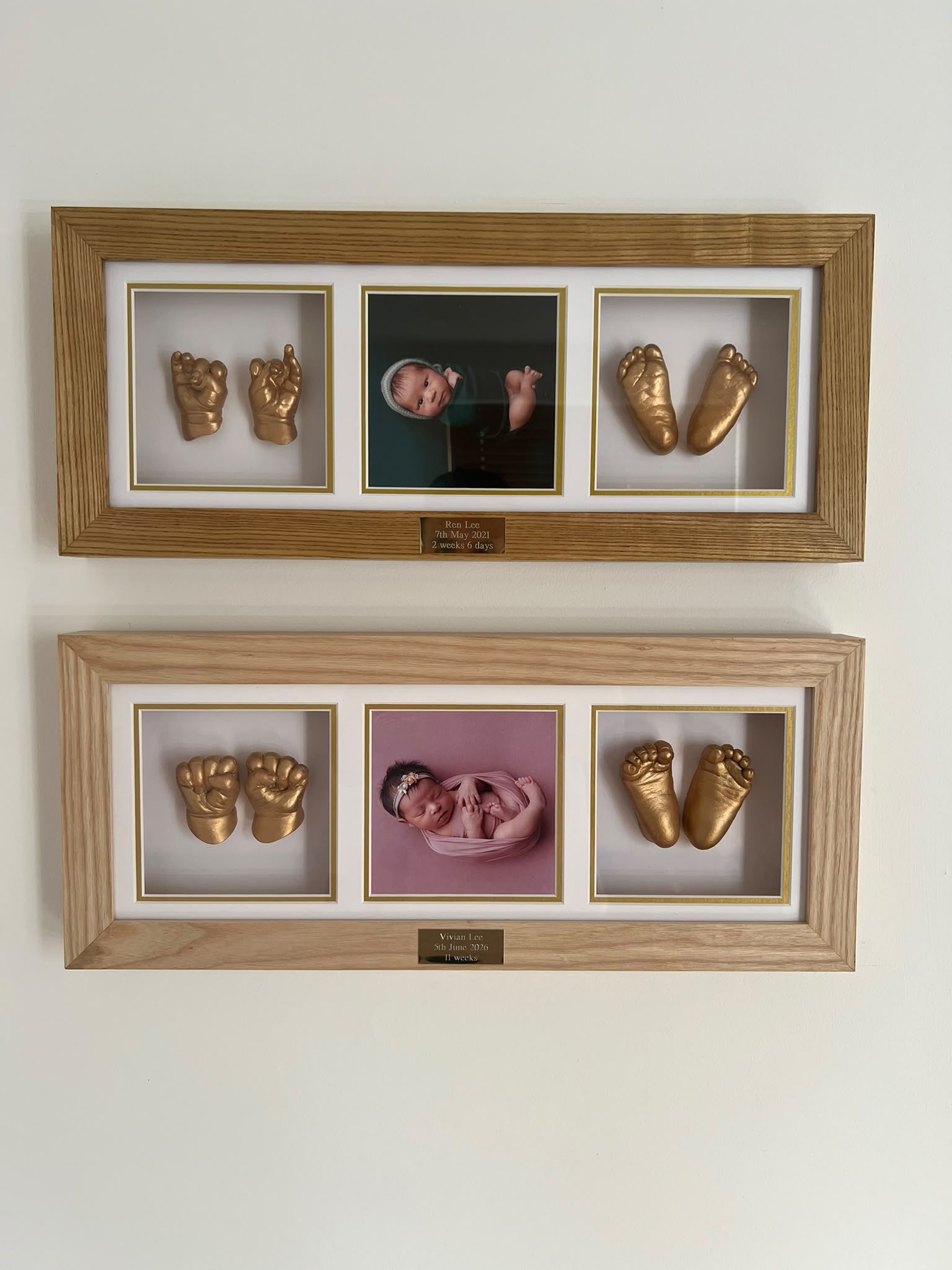 Framed newborn photographs and hand and foot casts made for Ren and Vivian